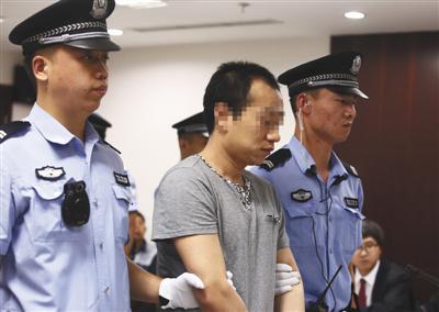 2018年7月6日，被告人高明（化名）在北京市三中院受审。 新京报记者 王贵彬 摄